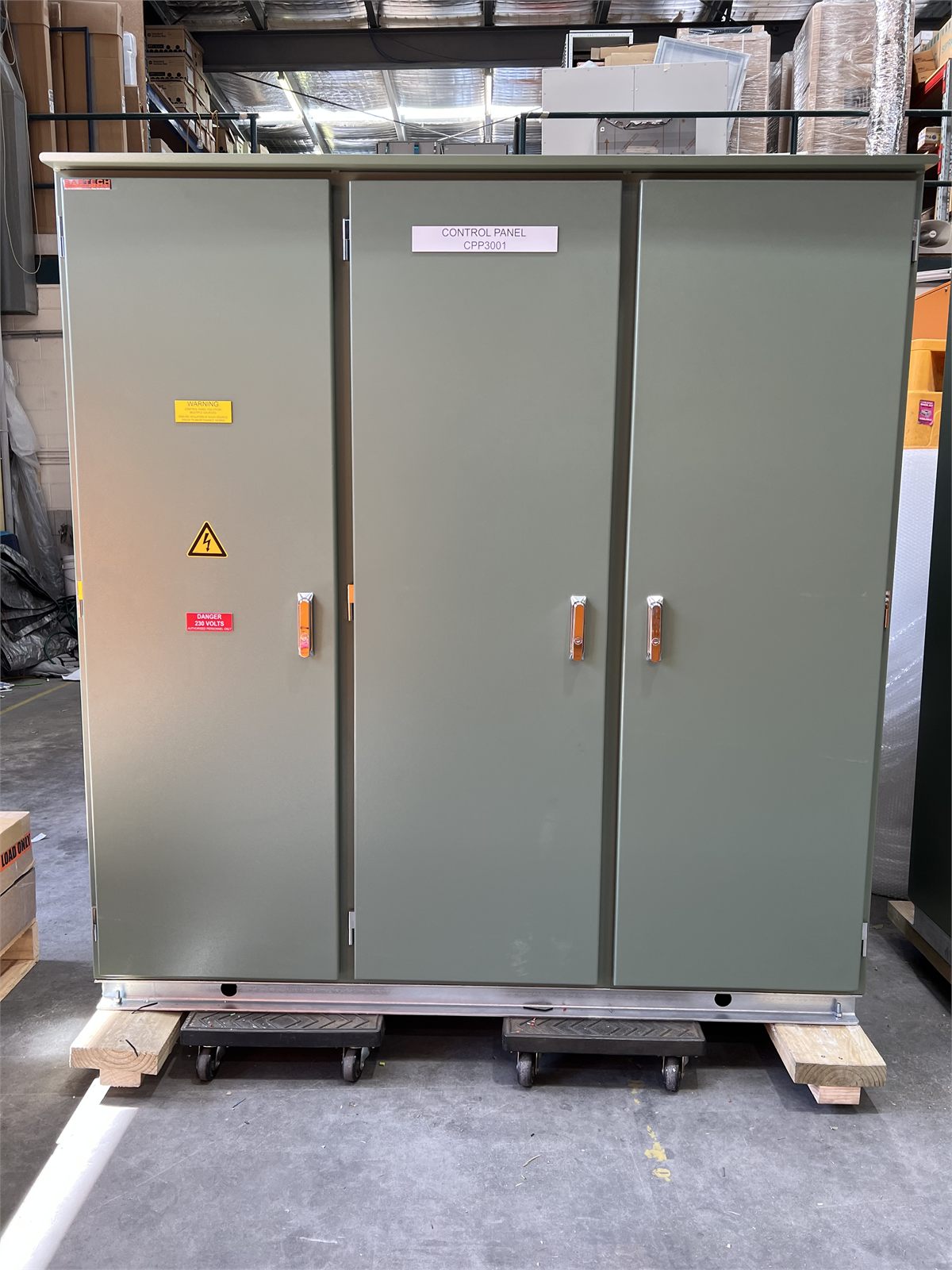 Completed green industrial control panel enclosure