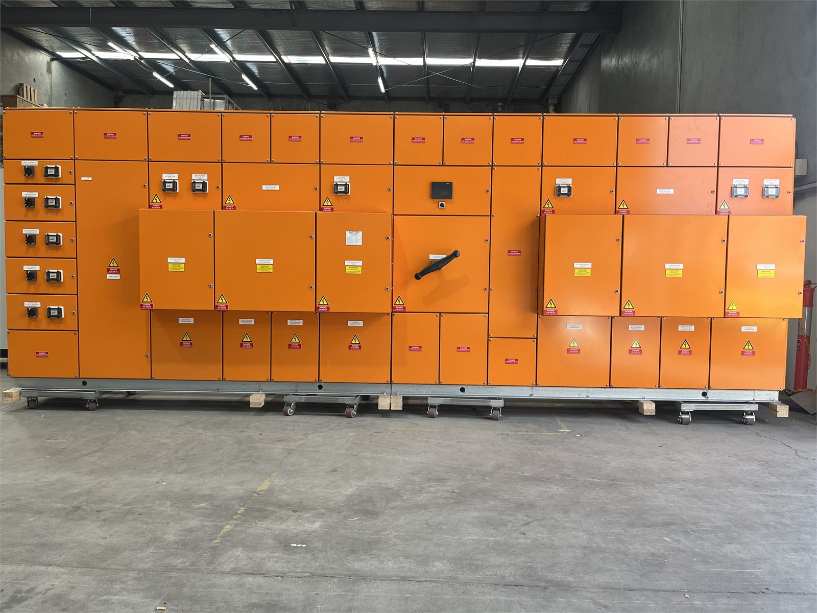 Large completed orange main switchboard with covers closed