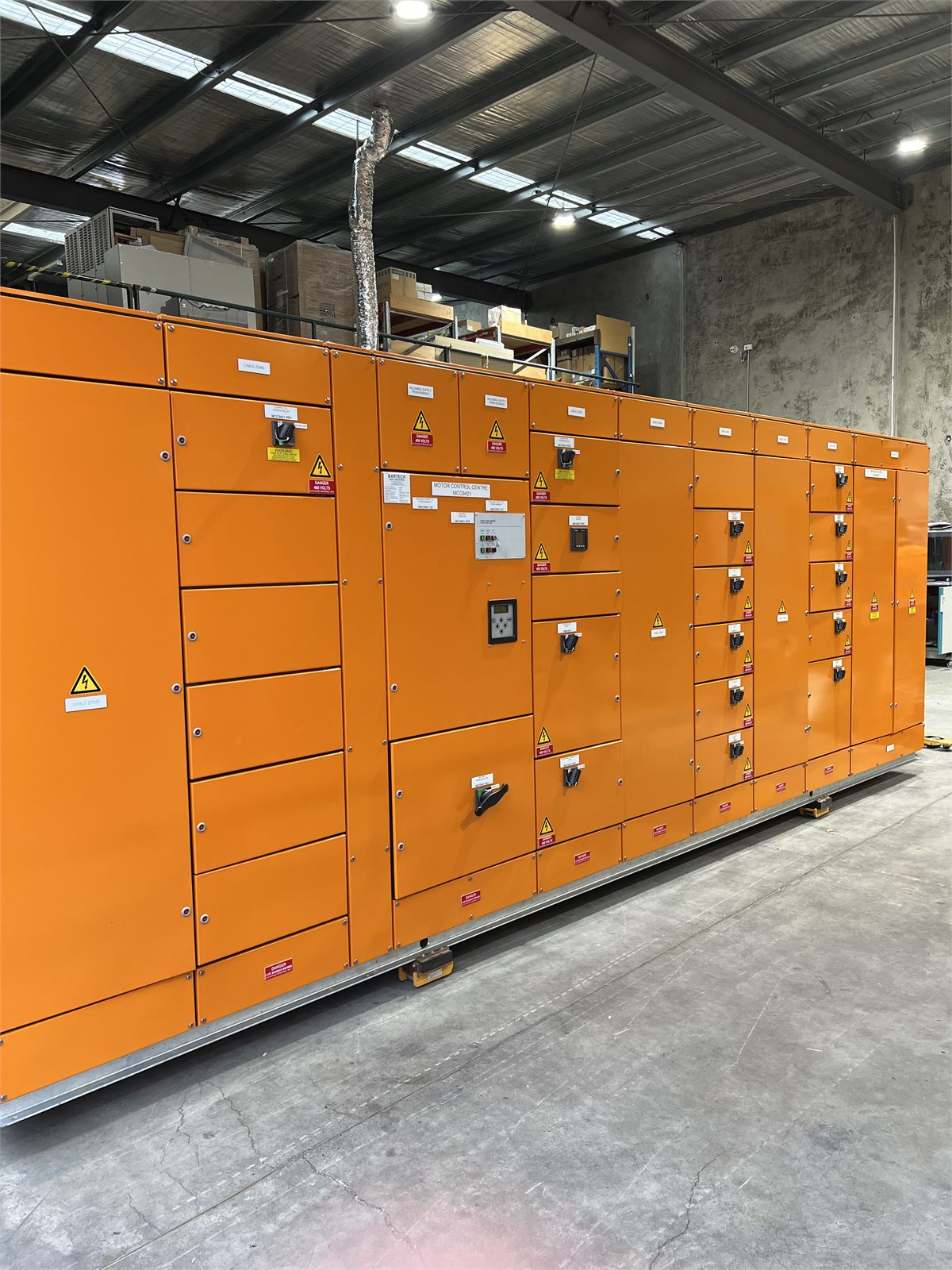 Large orange motor control centre in the Bartech workshop